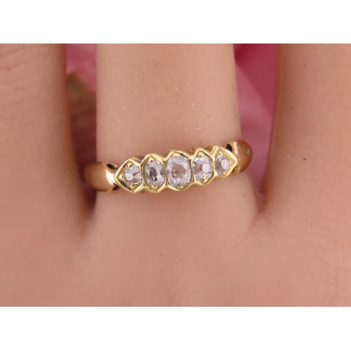 184 - 18ct Gold Antique Diamond Ring. Set with a row of cushion cut diamonds with an estimated combined we... 
