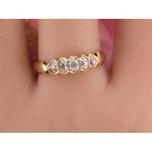 184 - 18ct Gold Antique Diamond Ring. Set with a row of cushion cut diamonds with an estimated combined we... 