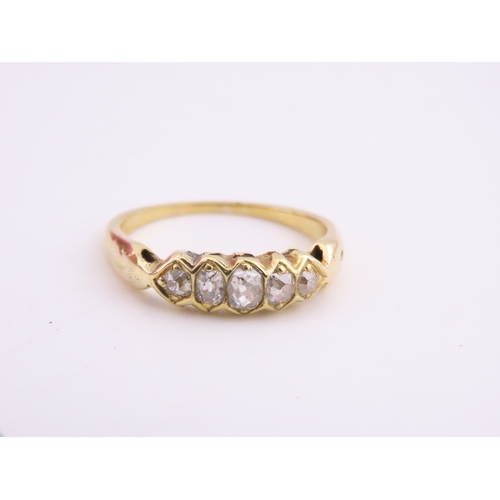 184 - 18ct Gold Antique Diamond Ring. Set with a row of cushion cut diamonds with an estimated combined we... 