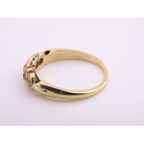 184 - 18ct Gold Antique Diamond Ring. Set with a row of cushion cut diamonds with an estimated combined we... 