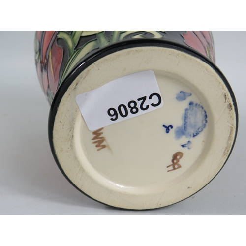 75 - Moorcroft vase  Palmata design with red floral design on black ground - 23cm tall