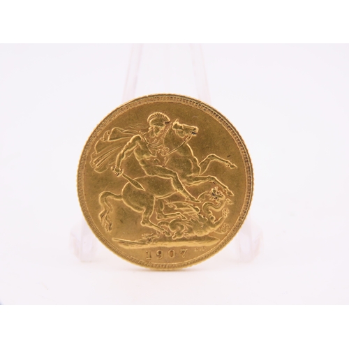 186 - A gold full sovereign dated 1907, struck in 22 carat gold and featuring the St George and the Dragon... 