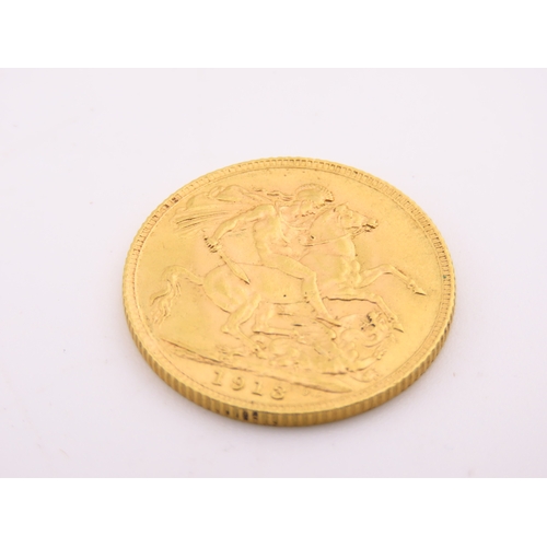 187 - A gold full sovereign dated 1913, struck in 22 carat gold and featuring the St George and the Dragon... 