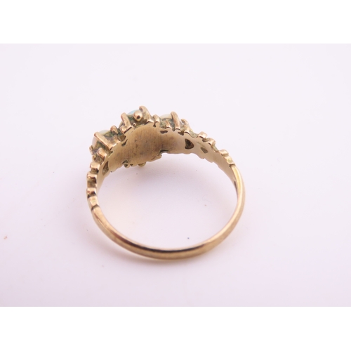 190 - A 9 carat gold opal trilogy ring, set with three graduated oval cabochon opals displaying characteri... 