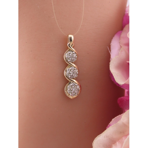 193 - A 9 carat gold diamond set pendant, designed as a graduated three stone drop set with round brillian... 