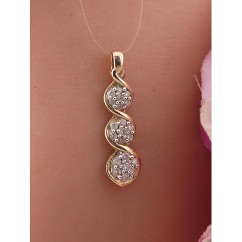 193 - A 9 carat gold diamond set pendant, designed as a graduated three stone drop set with round brillian... 