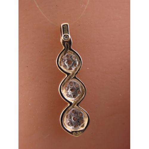 193 - A 9 carat gold diamond set pendant, designed as a graduated three stone drop set with round brillian... 