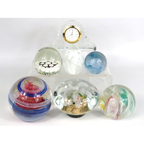 88 - Six glass paperweights some by Caithness plus crystal mantel clock