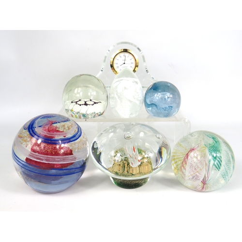 88 - Six glass paperweights some by Caithness plus crystal mantel clock