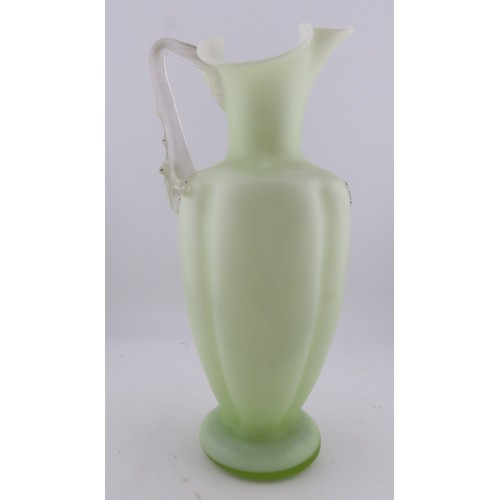 100 - A Victorian uranium glass jug, of baluster form with applied handle and butterfly and floral decorat... 