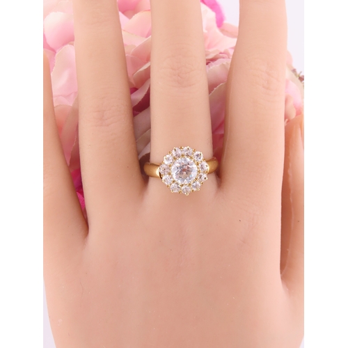 150A - A fine Victorian diamond cluster ring centred with a single old cut diamond surrounded by a border o... 