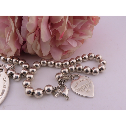 135a - Two Bracelets marked Tiffany and co 925, total weight 111 grams.