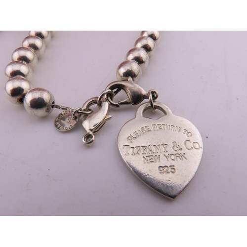 135a - Two Bracelets marked Tiffany and co 925, total weight 111 grams.