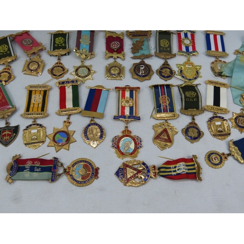 998 - A large selection of Masonic medals and badges, comprising enamelled and gilt metal examples with ri... 