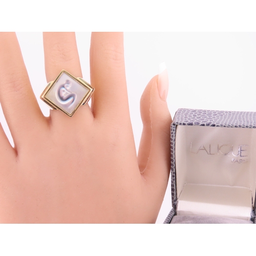 240 - A Lalique gold tone ring, of bold square form set with a frosted glass panel, signed Lalique, comple... 