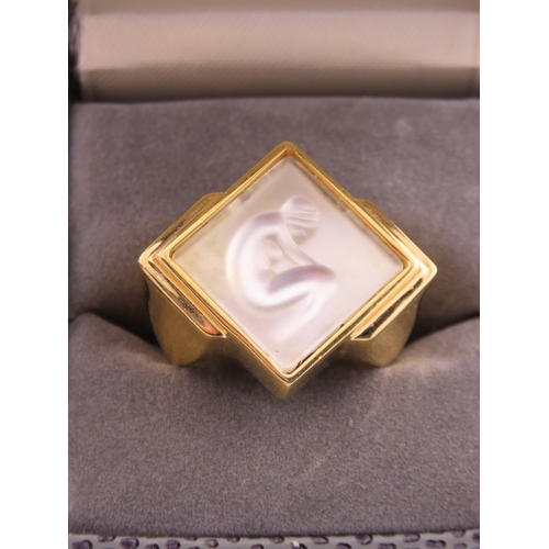 240 - A Lalique gold tone ring, of bold square form set with a frosted glass panel, signed Lalique, comple... 