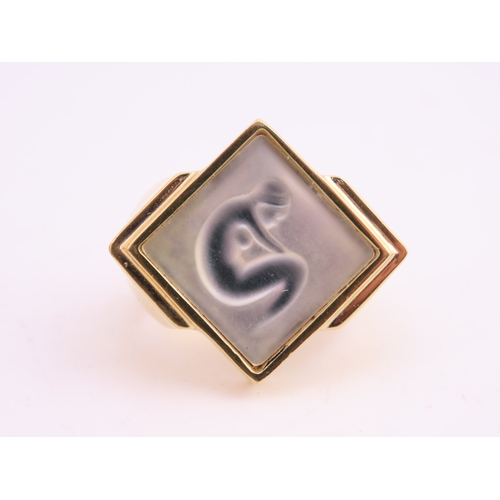 240 - A Lalique gold tone ring, of bold square form set with a frosted glass panel, signed Lalique, comple... 