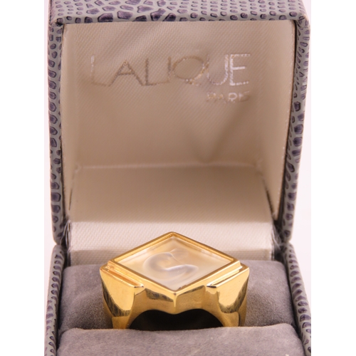240 - A Lalique gold tone ring, of bold square form set with a frosted glass panel, signed Lalique, comple... 