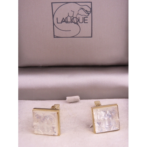 241 - A pair of Lalique gold tone cufflinks, each of square form set with frosted glass panels, signed Lal... 