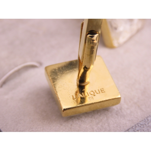 241 - A pair of Lalique gold tone cufflinks, each of square form set with frosted glass panels, signed Lal... 