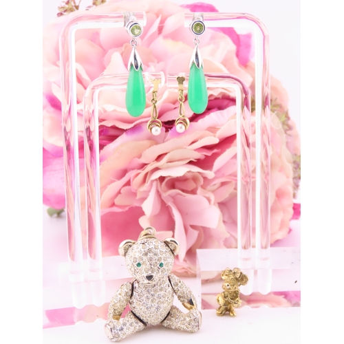 303 - A small group of jewellery comprising 9ct gold pearl earrings, sterling silver Minnie Mouse pendant,... 