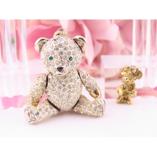 303 - A small group of jewellery comprising 9ct gold pearl earrings, sterling silver Minnie Mouse pendant,... 