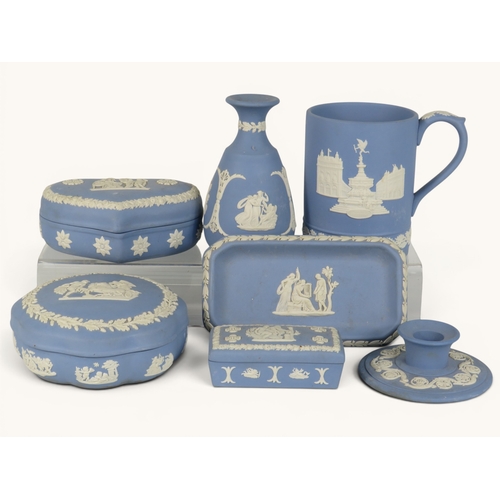 856 - Seven items of Wedgwood blue Jasperware including trinket boxes, small vase, tankard, tray and candl... 