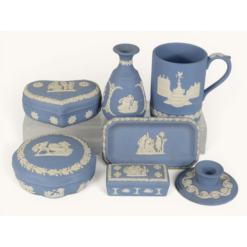 856 - Seven items of Wedgwood blue Jasperware including trinket boxes, small vase, tankard, tray and candl... 