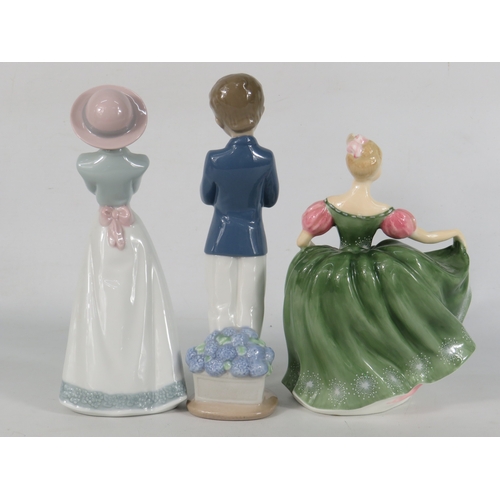25 - Two Nao figurines (boy and girl in praying poses) and a Royal Doulton lady in green dress - tallest ... 