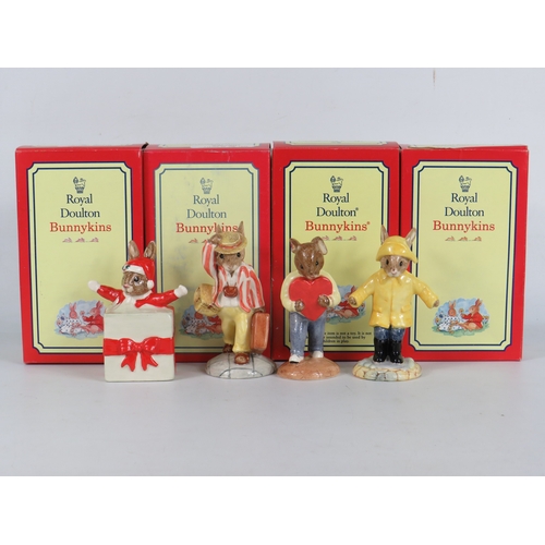 39 - Four boxed Royal Doulton Bunnykins figurines including Christmas Surprise, Daisy Father Bunnykins Fi... 