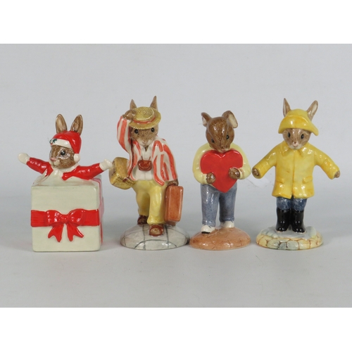 39 - Four boxed Royal Doulton Bunnykins figurines including Christmas Surprise, Daisy Father Bunnykins Fi... 