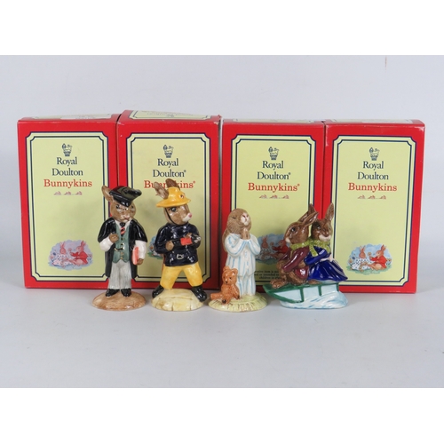 41 - Four boxed Royal Doulton Bunnykins figurines including Bedtime, Tyrolean Easter and graduate/fireman... 