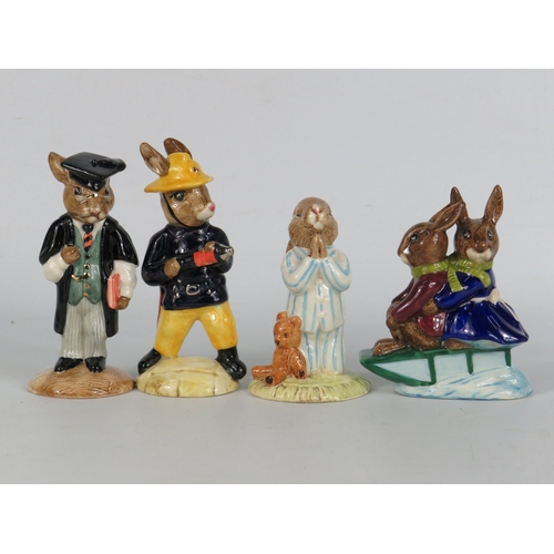 41 - Four boxed Royal Doulton Bunnykins figurines including Bedtime, Tyrolean Easter and graduate/fireman... 