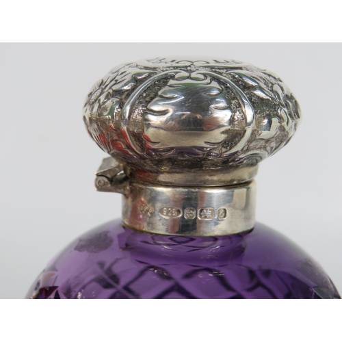 47 - Three antique coloured glass perfume bottles with sterling silver tops - cranberry etched floral glo... 