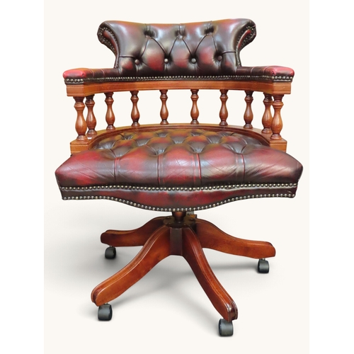 Traditional Chesterfield-style captain?s swivel chair upholstered in ...
