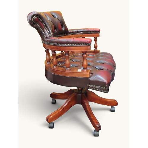 Traditional Chesterfield-style captain?s swivel chair upholstered in ...