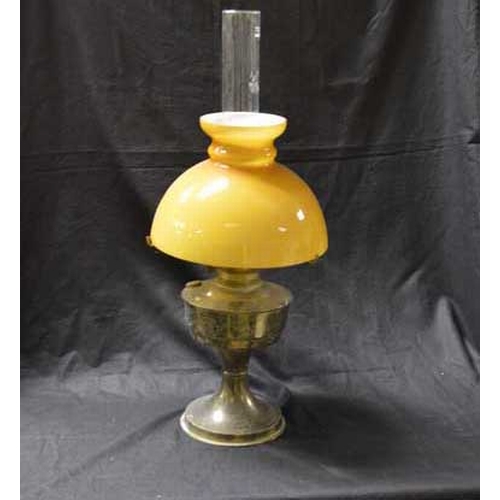 49 - A Brass Based Oil Lamp and Brown Glass Shade