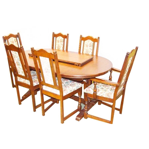 60 - A Very Good Oak Extending Dining Room Table including Six Upholstered Chairs inc Two Carvers