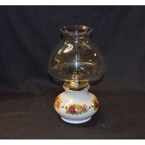 88 - A Porcelain Based Oil Lamp and Shade