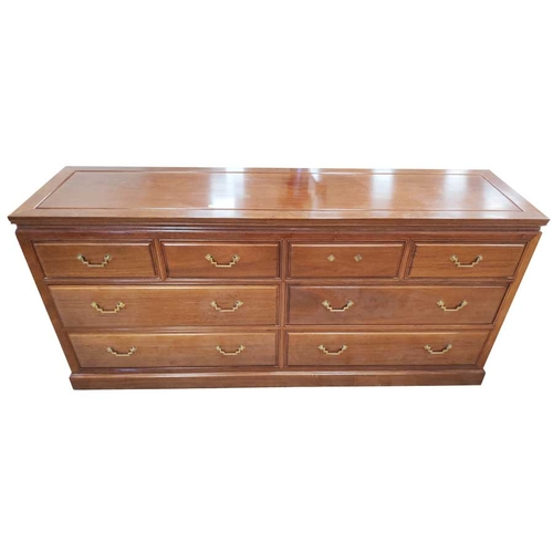 60 - An Eight Drawer Sideboard