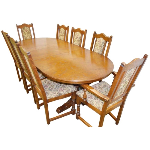 220 - A Very Good Oak Extending Dining Room Table and Matching Eight Chair Set