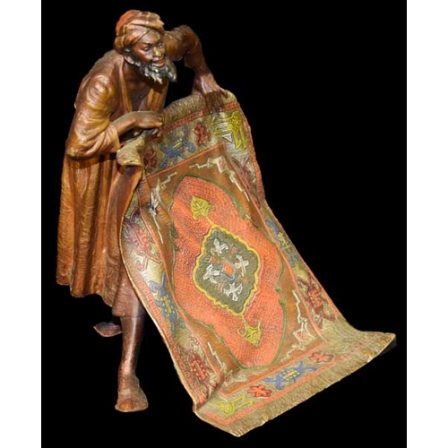 150 - A Rare Coal Painted Bronze Figurine 'The Carpet Seller'