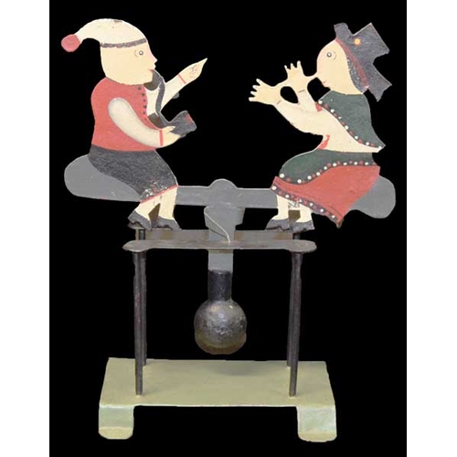 495 - An Ornamental Seesaw Figurine