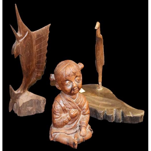 767 - A Carved Figurine of a Child and Two Others