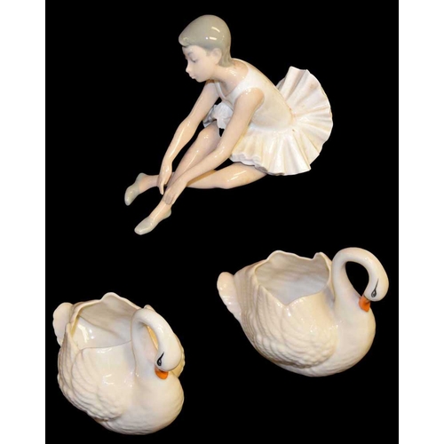 789 - A Nao Figurine 'Ballerina' and Two Donegal Pottery Swans