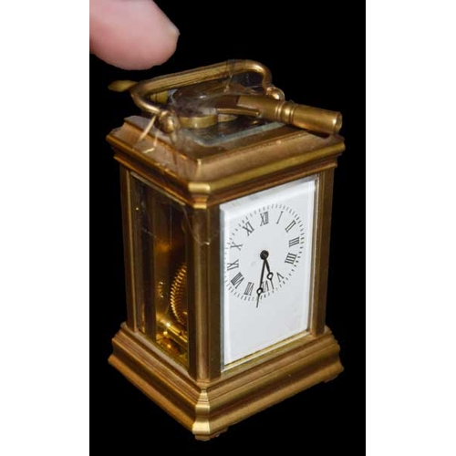 141 - A Miniature Brass Carriage Clock