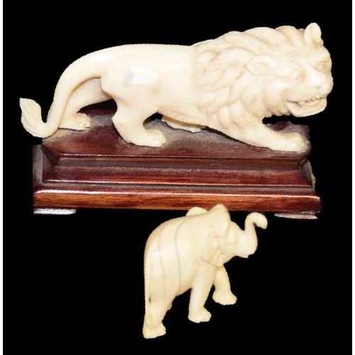 142 - A Nice Carved Figurine of a Lion and an Elephant