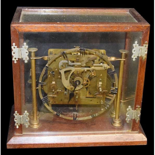 An Old Clock in a Glass Case