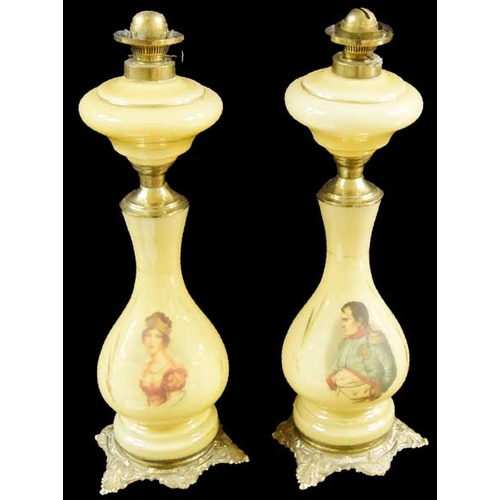 77 - An Unusual Pair of Glass and Gilted Metal Oil Lamps 'Napoleon and Cleopatra'