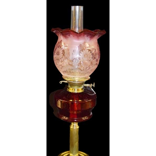 105 - A Brass and Ruby Bowl Oil Lamp With Etched Glass Ruby Shade